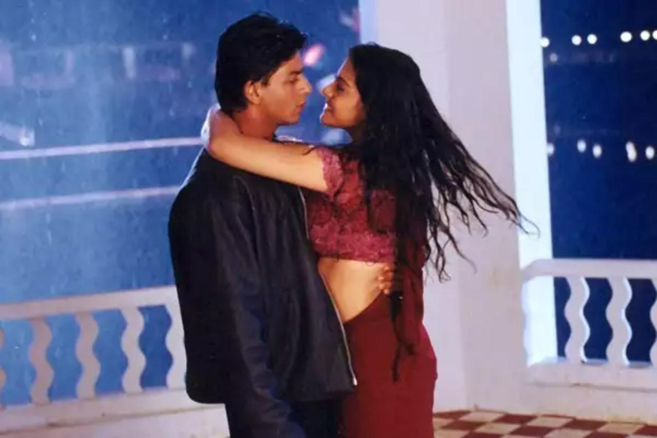 3. Kuch Kuch Hota Hai
In this film, Anjali, played by Kajol, sheds tears as Rahul, played by Shah Rukh Khan, confesses his love for Tina, portrayed by Rani Mukerji. The pouring rain hides their emotions. Years later, when Rahul re-enters Anjali's life, they find themselves drawn to each other once more during a heavy downpour. Seeking shelter under a canopy, they share a slow dance against the backdrop of the rain, creating a truly memorable and romantic moment in Bollywood cinema